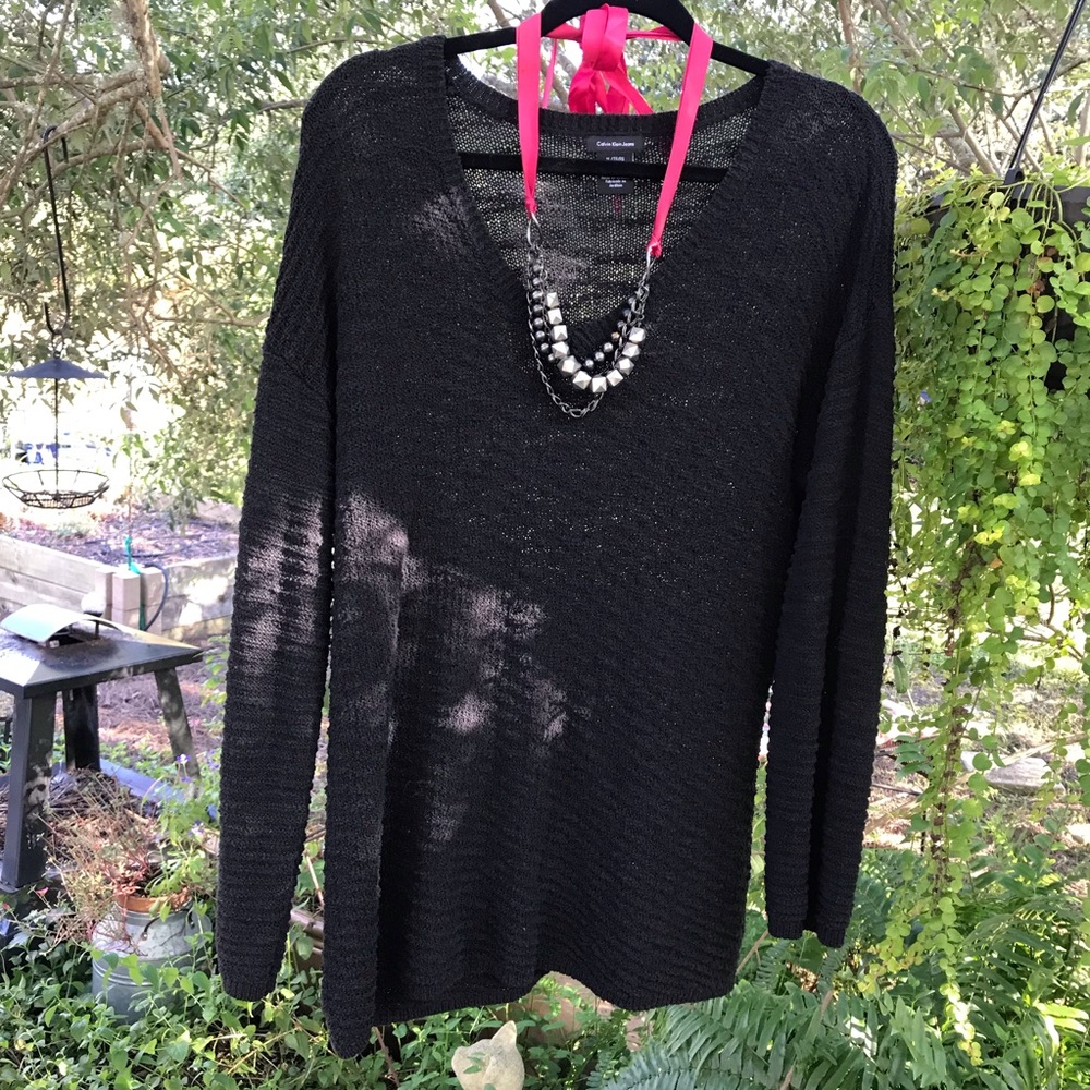 Calvin Klein Jeans brand long, black sweater.